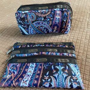 Pair of LeSportsac cosmetic bag/pouches in a brown print nwot